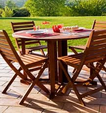 Teak outdoor furniture in a beautiful garden setting